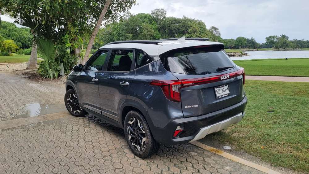 Kia Seltos, rear three-quarter view by the lagoon